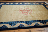 Vintage Chinese Peking rug's multi-dragon faced border with pawn motif in cobalt blue.
