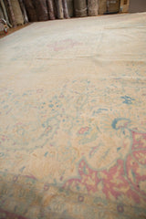 Distressed Bulgarian Kerman featuring faded blush, powder blue millefleur on ivory field.