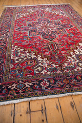 The plush cherry red pile and navy turtle-motif border of a vintage Mehrivan carpet.