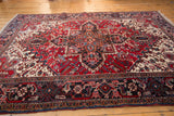 A vintage Mehrivan carpet's intricate serrated medallion and meandering turtle design border.