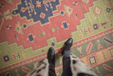 Vintage Stone Wash Dhurrie flatweave with stepped geometric motifs in raspberry, navy, and sage.