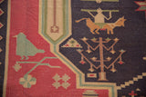 Close-up of vintage Stone Wash Dhurrie rug: geometric tree-of-life, bird, animal motifs.