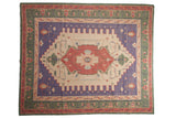 Vintage hand woven Dhurrie rug featuring an elongated central medallion, stepped spandrels, red, blue, green, ivory.