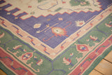 Vintage Dhurrie rug corner detail with stepped spandrels in green, blue, and raspberry.