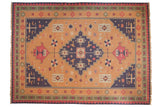Vintage Stone Wash Dhurrie carpet features geometric medallion, gold, dusty navy, faded red.