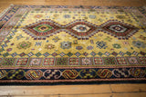 Dark blue border of the Siberian Caucasian rug with geometric and curvilinear patterns.
