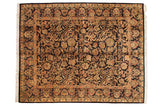Vintage Indian Arts and Crafts carpet with intricate palmette vinery on navy black field.
