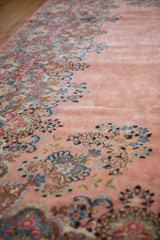 Soft, full pile and detailed millefleur border of a vintage Persian Kerman carpet in dusty rose.
