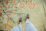 Vintage Japanese Art Deco carpet showing plush seafoam green pile with ornate flowering branches.