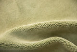 Plush, soft seafoam green pile of the vintage Japanese Art Deco carpet, highlighting its deep texture.