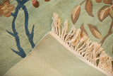 Plush seafoam green pile, blue vine, original selvage, and neat fringe.