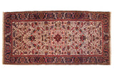 Vintage Mehrivan rug runner with geometric floral palmettes in navy blue, red, and gold over an ivory field.
