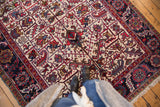 An overhead perspective of the intricate geometric pattern and full pile on a vintage Mehrivan rug.