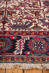 Intact ivory fringe and detailed geometric border in navy and red on a vintage Mehrivan runner.