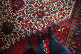 Close view of the even pile and serrated leaf lattice pattern on a vintage Persian Mehrivan carpet.