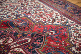 Lattice of serrated leaves and medallion detail on a vintage Mehrivan carpet with even pile.