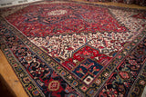 Vintage Mehrivan carpet detail: ivory field, cherry red patterns, navy Samovar border.