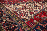 Heriz style vintage Mehrivan rug with geometric palmettes and navy turtle border.