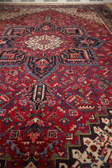 Heriz style field pattern on Vintage Mehrivan carpet with cherry red, navy, ivory palmettes.
