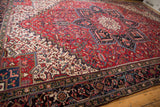 Persian Mehrivan rug's deep navy main border with inverted Samovar and turtle motifs.