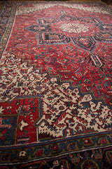Cherry red and navy blue main border of the Mehrivan rug with inverted Samovar motif.