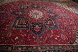 Vintage Mehrivan rug's navy border with inverted Samovar turtle motif and cherry red field.