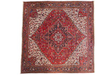 A square vintage Mehrivan carpet with a red and navy medallion, ivory field, and samovar turtle border.