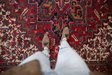 Detailed view of the vintage Mehrivan's full pile and bold geometric patterns in cherry red and navy.