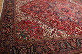Corner detail of a vintage Heriz carpet showing the fine weave and gem-tone colors.