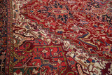 Intricate, gem-toned serrated leaf and geometric motifs on a fine vintage Heriz rug.