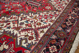 Full wool pile and detailed borders in cherry red, navy, and gold on a vintage Mehrivan carpet.