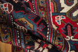 Dense, full wool pile of a vintage Mehrivan carpet in charcoal, aqua, and cherry red.