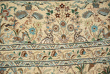 Detailed view of two hand-knotted rabbits in a forest scene on a vintage Persian Tabriz carpet.