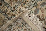 Folded corner of the hand-knotted Persian rug showing its original intact fringe and side selvage.