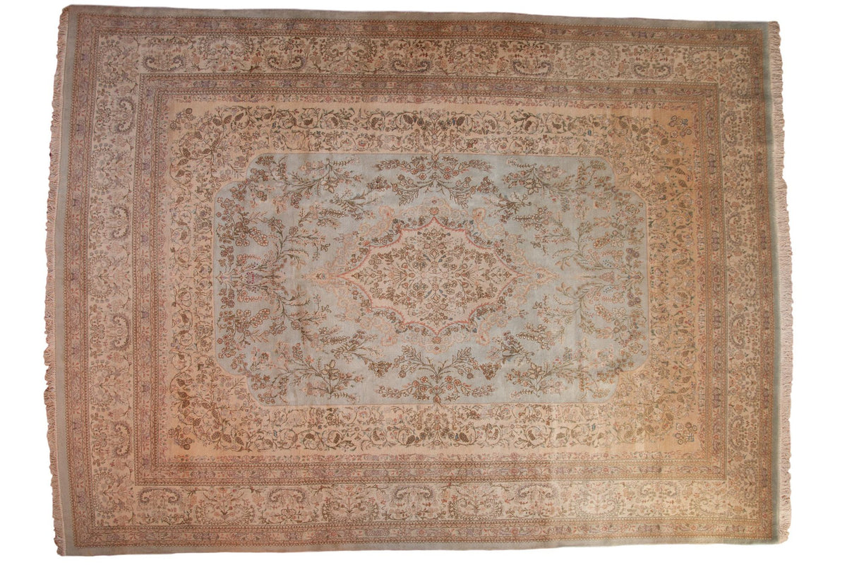Vintage Tabriz rug with a delicate scalloped medallion and floral design in powder blue, ivory, and beige.