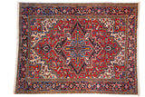 Vintage Mehrivan carpet with a quatrefoil medallion, geometric floral field in red, and a navy blue turtle border.