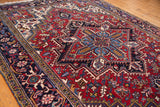 Low angle view of the vintage Mehrivan carpet highlighting its dense, full pile and rich geometric pattern.