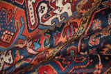 Hand-knotted Heriz carpet pile texture with blossomed shrub and trefoil motifs.