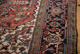 Intact side cord selvage and full wool pile on the corner of a vintage Heriz rug.