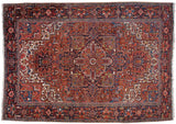 Hand-knotted Vintage Heriz carpet, brick red with concentric geometric medallion and vinery.