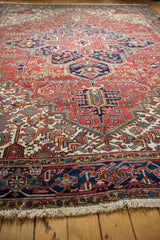 Low angle view of the vintage Mehrivan carpet's full pile and detailed geometric patterns.