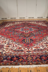 Angled view across the full, even pile of a vintage hand-knotted Heriz carpet.