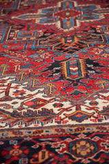 Close view of the dense, hand-knotted pile on a vintage Persian Heriz carpet.