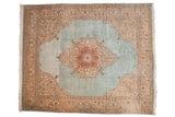 Vintage Tabriz carpet: powder blue abrashed field, terra cotta medallion, scrolling floral borders, 11'7