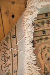 Plush ivory fringe and intact side cord selvage on a hand-knotted vintage Tabriz rug.