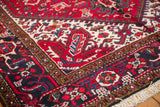 Corner detail of a vintage Mehrivan carpet showing its dense, full pile and crisp geometric borders.
