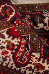 Hand-knotted texture and full pile of a vintage Mehrivan carpet in red and navy.