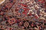 Vintage Mehrivan rug corner: dark borders with blue, red, blush patterns on ivory field.