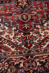Vintage Mehrivan rug's full pile, brick red and navy curvilinear floral motifs.