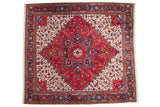 Vintage Mehrivan square carpet with a red starburst center medallion, navy blue accents, and a geometric ivory field.